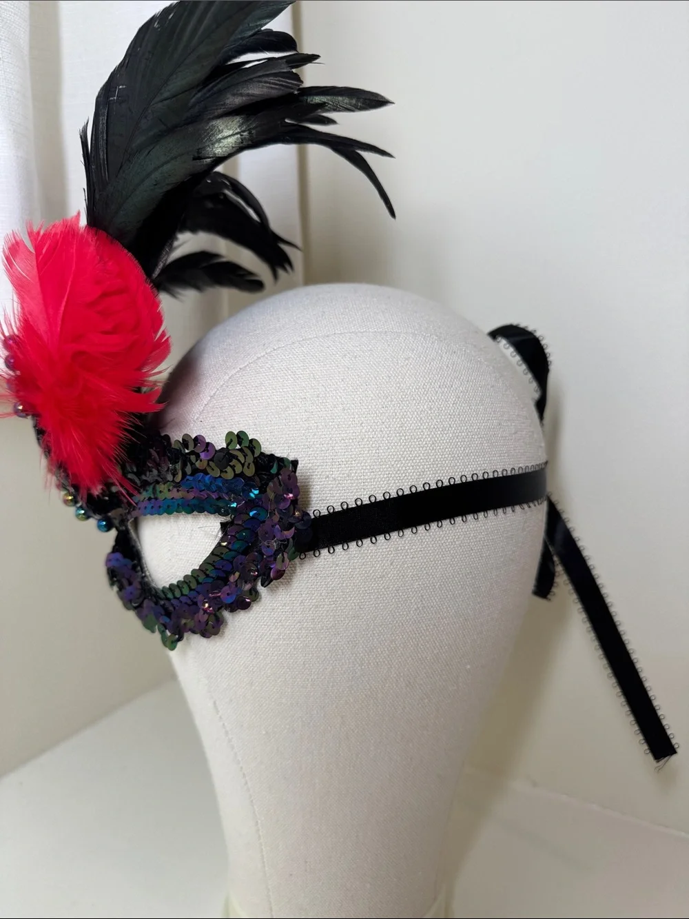 Handmade sequined and feathered mask from New Orleans.